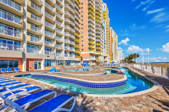 view of pool featuring a hot tub