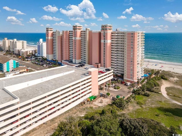 birds eye view of property featuring a view of the beach and a water view