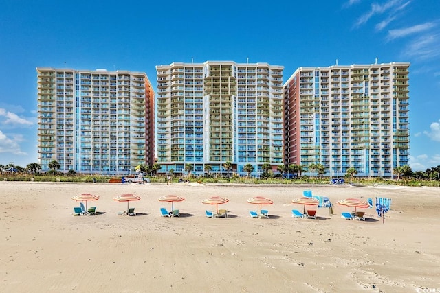 view of building exterior with a beach view