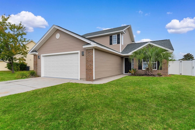 view of front facade with a garage and a front yard