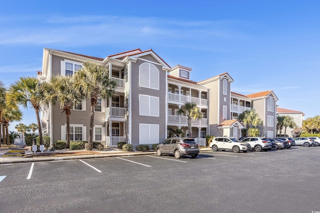4210 Coquina Harbour Dr Unit A-16, Little River, SC 29566 - view of apartment building / complex featuring uncovered parking