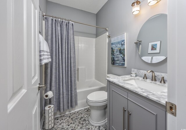 full bathroom with toilet, vanity, and shower / bath combination with curtain