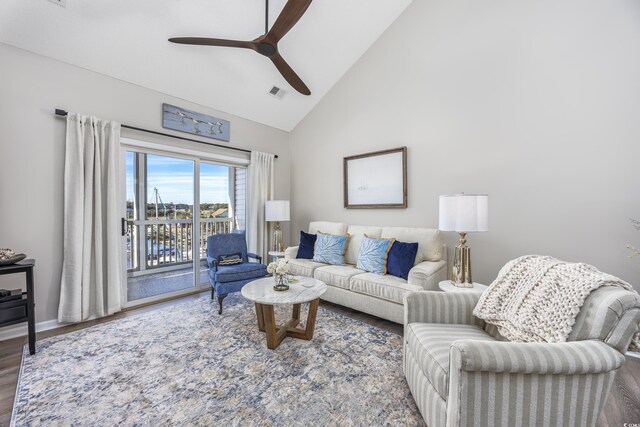 living room featuring ceiling fan, high vaulted ceiling, and hardwood / wood-style floors