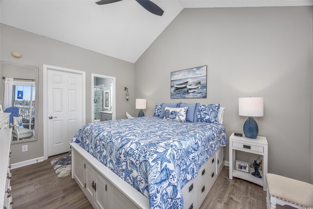 bedroom with ensuite bathroom, ceiling fan, vaulted ceiling, and light wood-type flooring