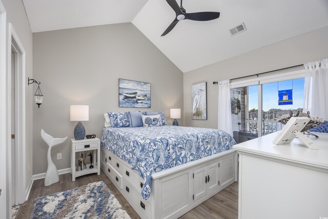 bedroom featuring ceiling fan, light hardwood / wood-style flooring, access to outside, and vaulted ceiling