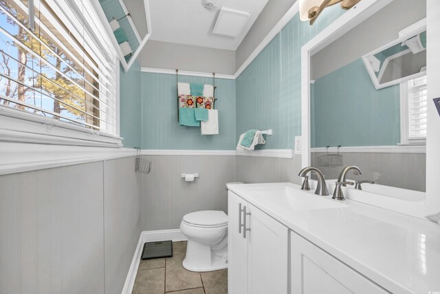 789 University Forest Cir, Conway, SC 29526 - bathroom with tile patterned flooring, toilet, a wainscoted wall, vanity, and baseboards