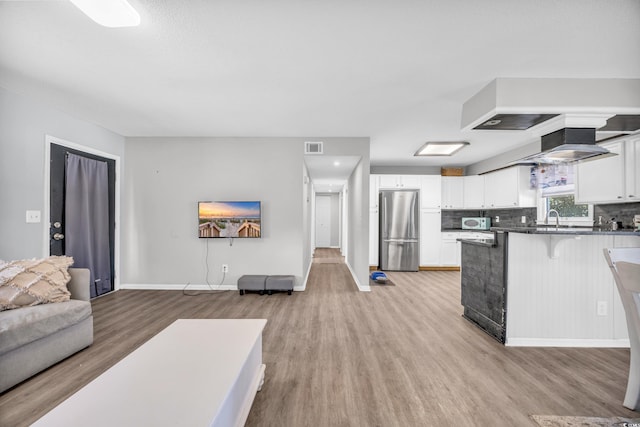 789 University Forest Cir, Conway, SC 29526 - living room with light wood-type flooring and baseboards