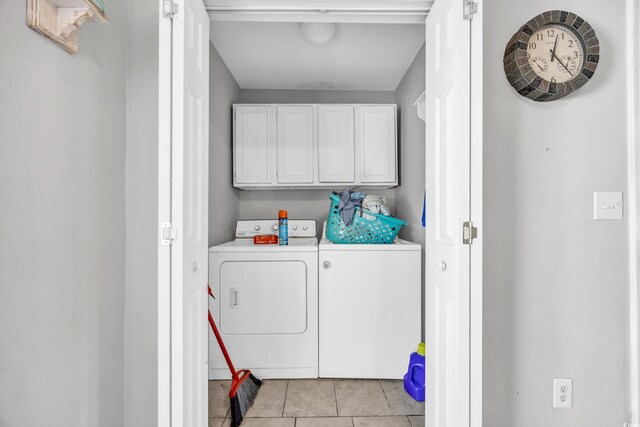 789 University Forest Cir, Conway, SC 29526 - laundry area featuring independent washer and dryer, cabinet space, and light tile patterned floors