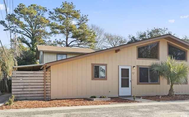 view of front facade with a carport