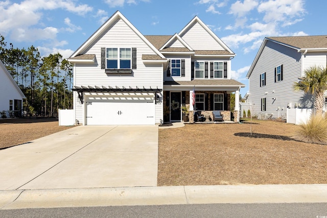 craftsman-style house featuring a garage and covered porch