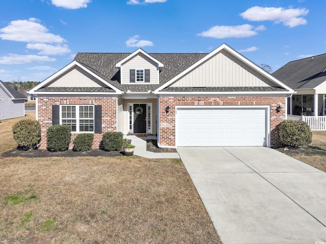 view of front of house featuring a front yard and a garage