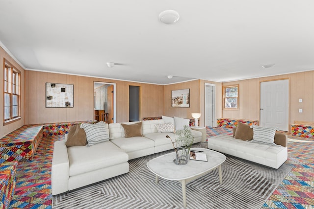 living room featuring carpet and crown molding