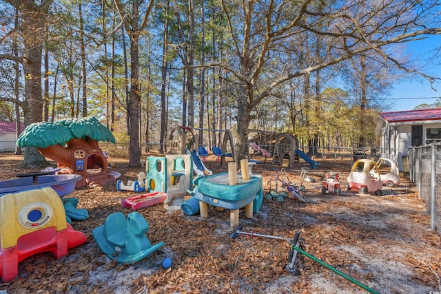 view of yard with playground community and fence