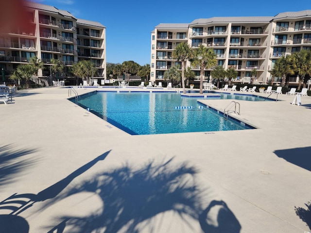 view of swimming pool featuring a patio area