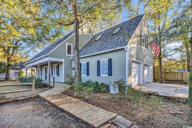 view of front of house featuring a garage and covered porch