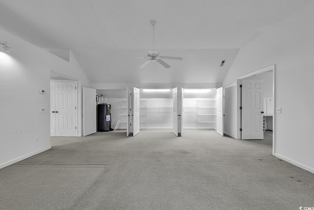 unfurnished living room featuring light carpet, ceiling fan, lofted ceiling, and electric water heater