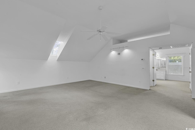 bonus room featuring light carpet, ceiling fan, and lofted ceiling