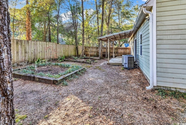 view of yard featuring central air condition unit