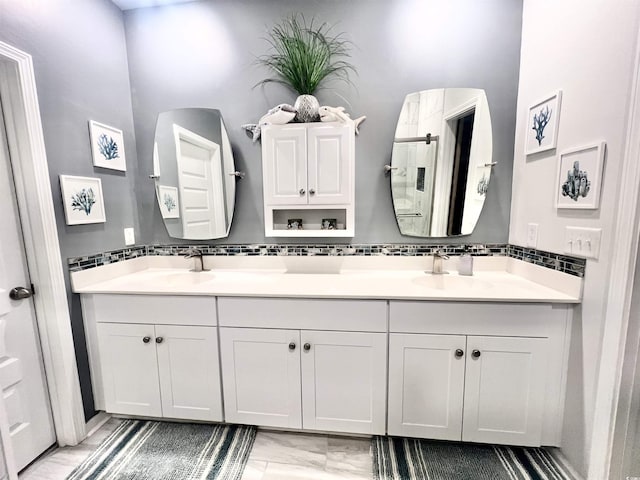 bathroom with vanity and backsplash