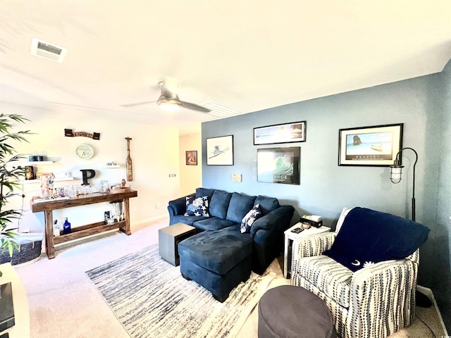 living room featuring light carpet and ceiling fan