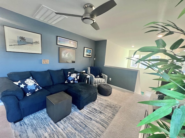 living room featuring ceiling fan and carpet floors