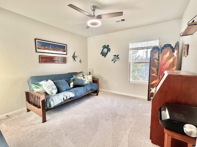 interior space with ceiling fan and light carpet