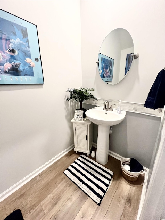 bathroom featuring sink and hardwood / wood-style floors