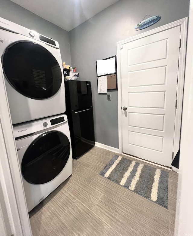 laundry area with stacked washer / dryer