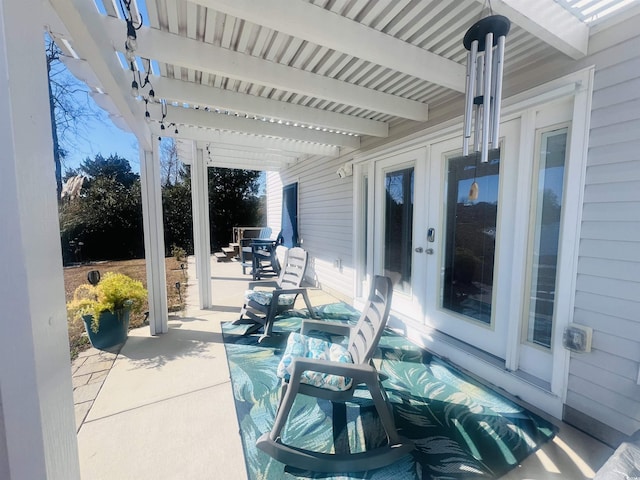 view of patio / terrace with a pergola and french doors