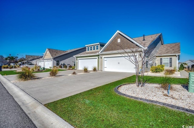 view of front of property featuring a front lawn and a garage