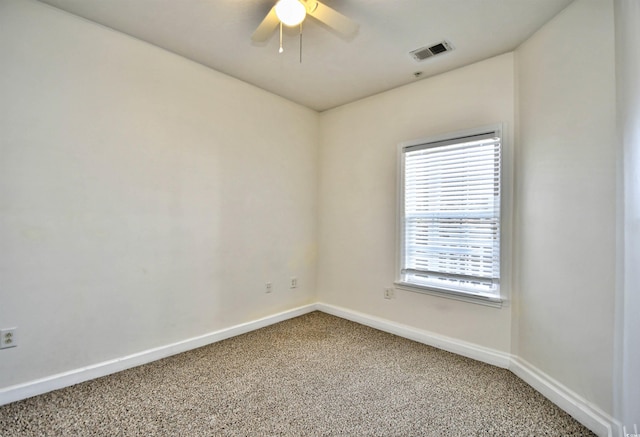 unfurnished room with ceiling fan, carpet, visible vents, and baseboards