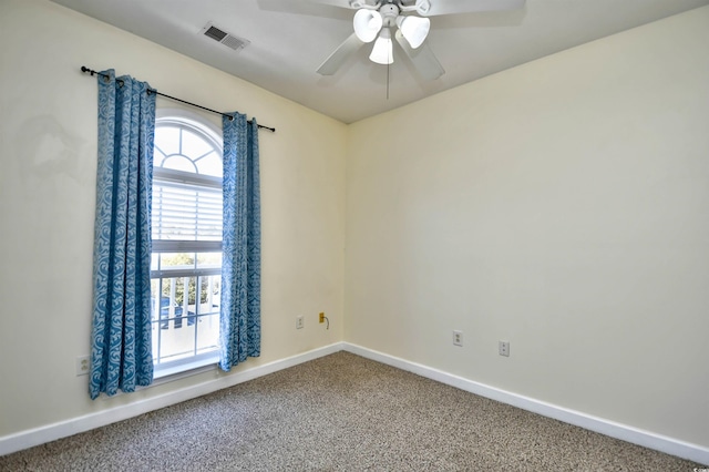 empty room featuring baseboards, carpet, visible vents, and a healthy amount of sunlight