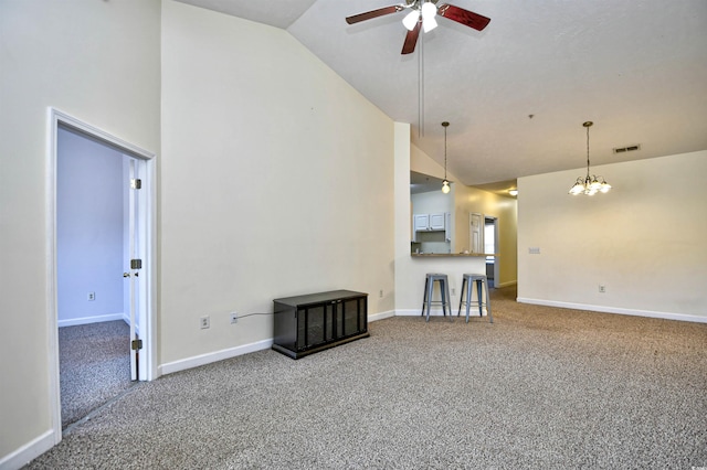 unfurnished living room featuring carpet floors, high vaulted ceiling, and baseboards