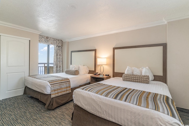 bedroom with a textured ceiling and ornamental molding