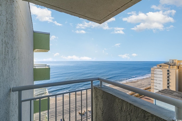 balcony featuring a water view and a view of the beach