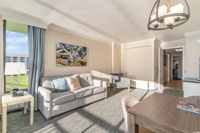 living room with a textured ceiling, a chandelier, and crown molding