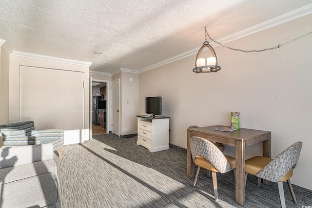 carpeted dining area featuring a textured ceiling and crown molding