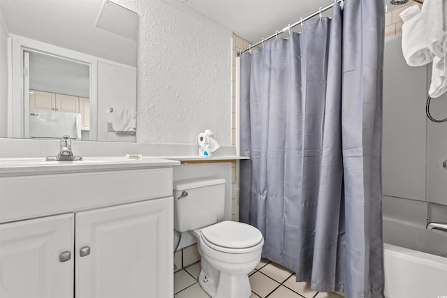 bathroom with a textured wall, toilet, vanity, tile patterned floors, and shower / bathtub combination with curtain