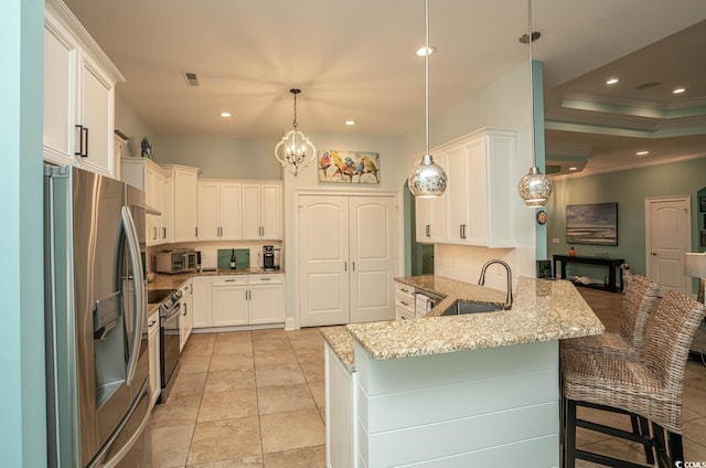 kitchen with pendant lighting, white cabinets, sink, stainless steel fridge with ice dispenser, and kitchen peninsula