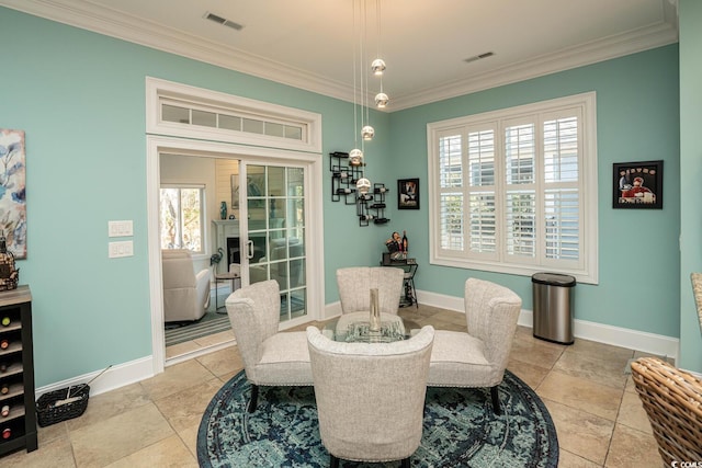 dining space with ornamental molding