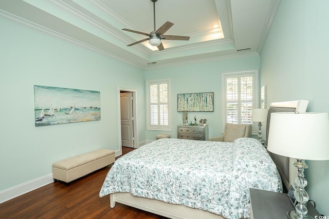 bedroom with ceiling fan, crown molding, a raised ceiling, and multiple windows