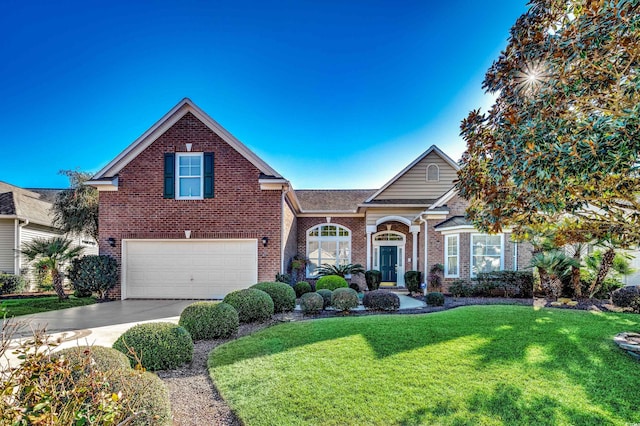 view of front of home with a garage and a front yard