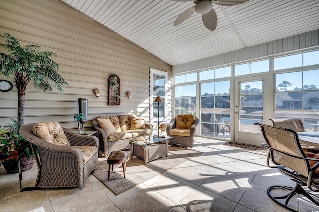 sunroom featuring vaulted ceiling and ceiling fan