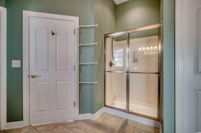 bathroom featuring tile patterned floors and walk in shower