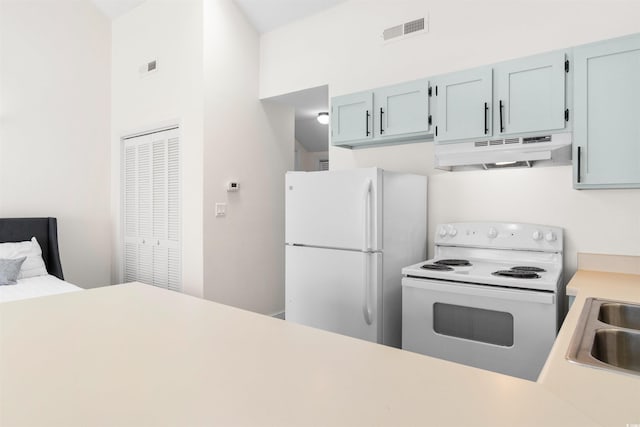 kitchen with sink and white appliances