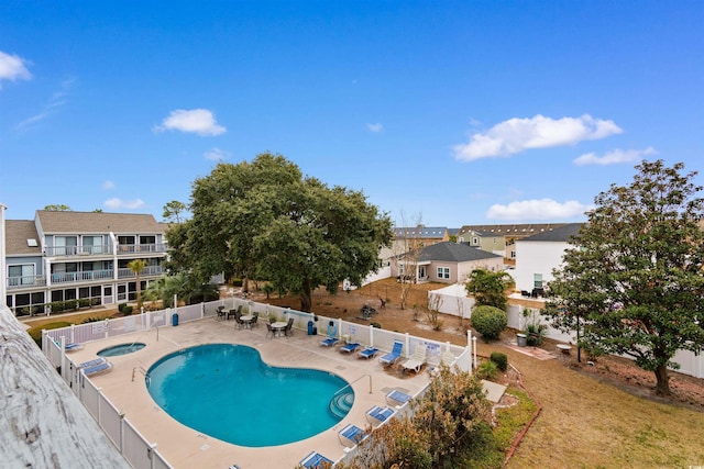 view of pool featuring a patio and a community hot tub