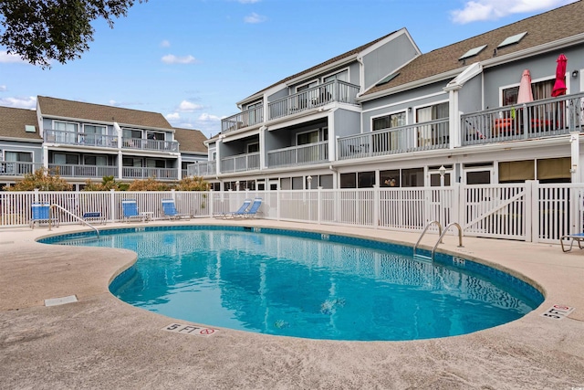 view of swimming pool with a patio area