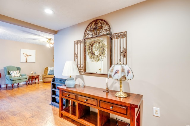 home office featuring ceiling fan and light wood-type flooring