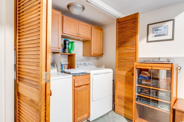 laundry area featuring cabinets and separate washer and dryer