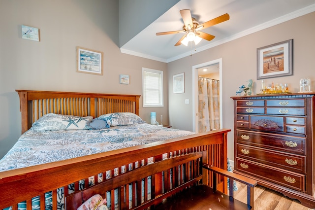 bedroom with hardwood / wood-style flooring, ceiling fan, ornamental molding, and ensuite bathroom